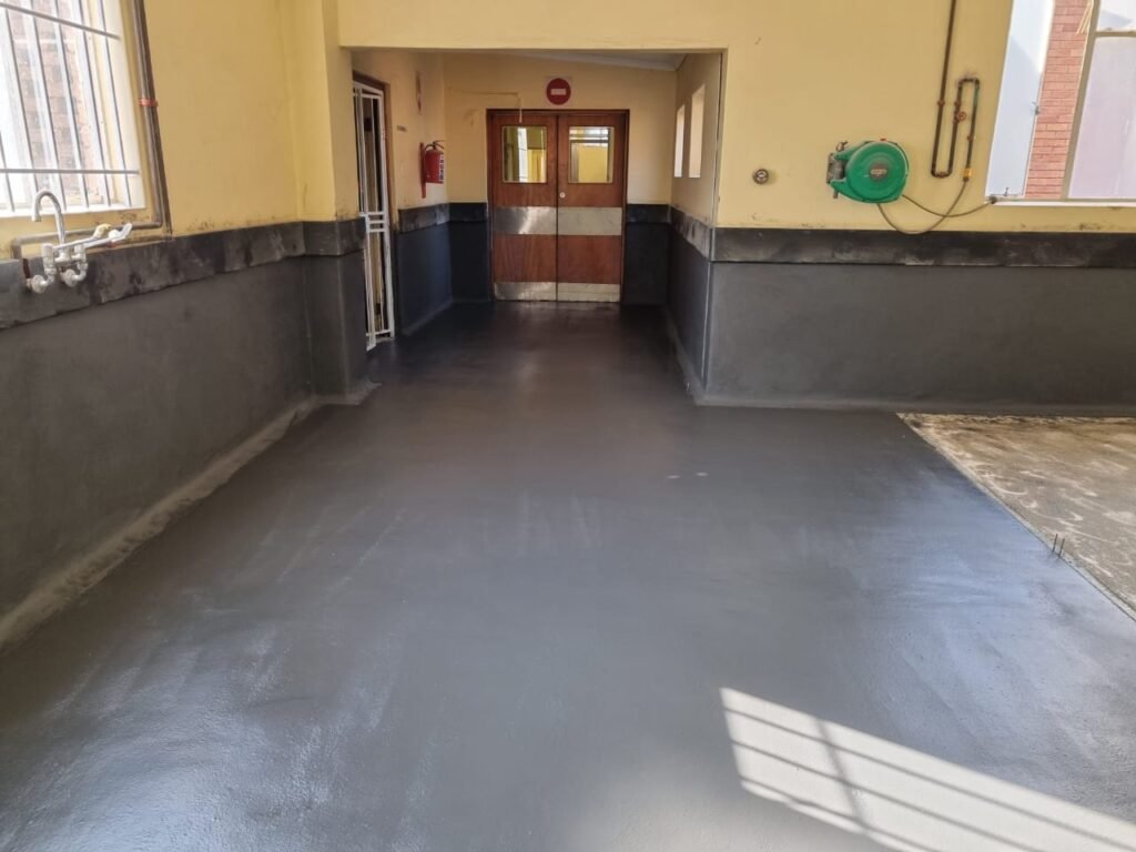 A hall interior with a newly applied epoxy floor showing a smooth, glossy and durable surface