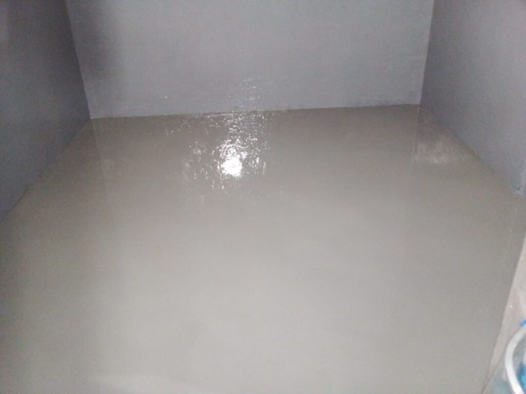 Indoor floor treated with epoxy and waterproofing by APR Waterproofing, creating a smooth and protective surface