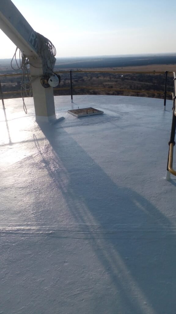 Flat silo roof treated by APR Waterproofing showing the completed waterproofing coating