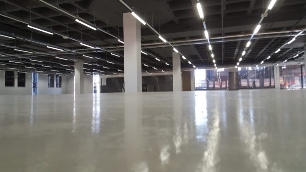 Indoor floor with epoxy coating applied by APR Waterproofing, showing a smooth, durable finish.