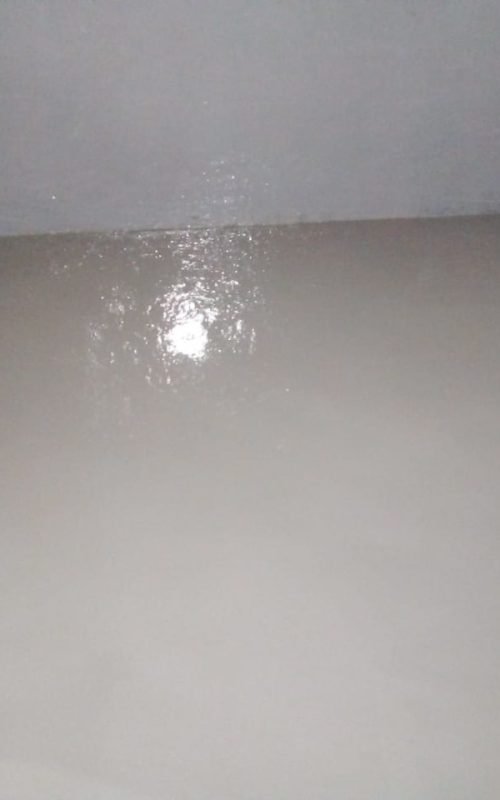 Indoor floor treated with epoxy and waterproofing by APR Waterproofing, creating a smooth and protective surface